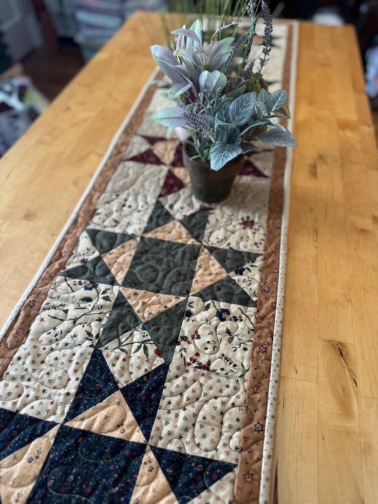 a potted plant sitting on top of a wooden table