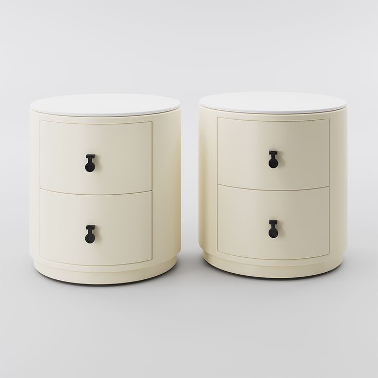 two white nightstands side by side against a gray background with black handles and knobs