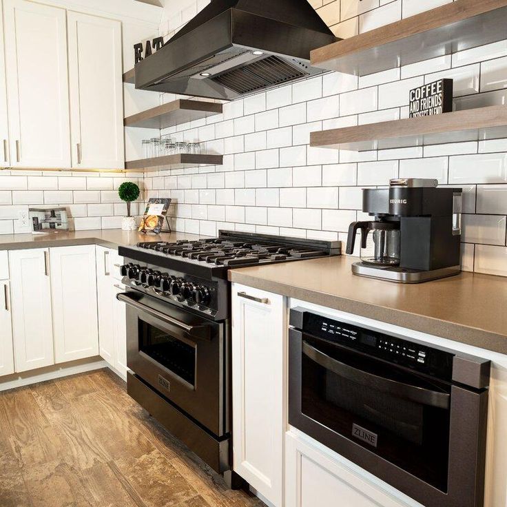 the kitchen is clean and ready for us to use it's stove top oven