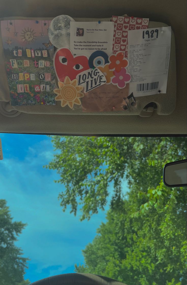 the back window of a vehicle with stickers on it