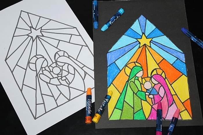 stained glass and crayons with colored pencils next to the image of mary and jesus