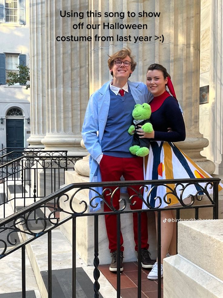 a man and woman standing next to each other on the steps with their stuffed animals