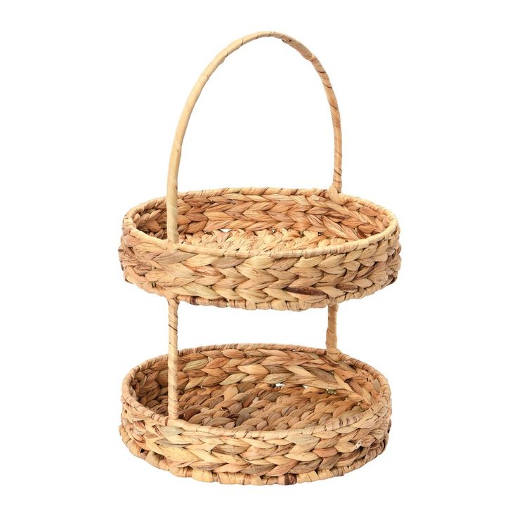 two tiered wicker basket with handles on each side, one holding a handle