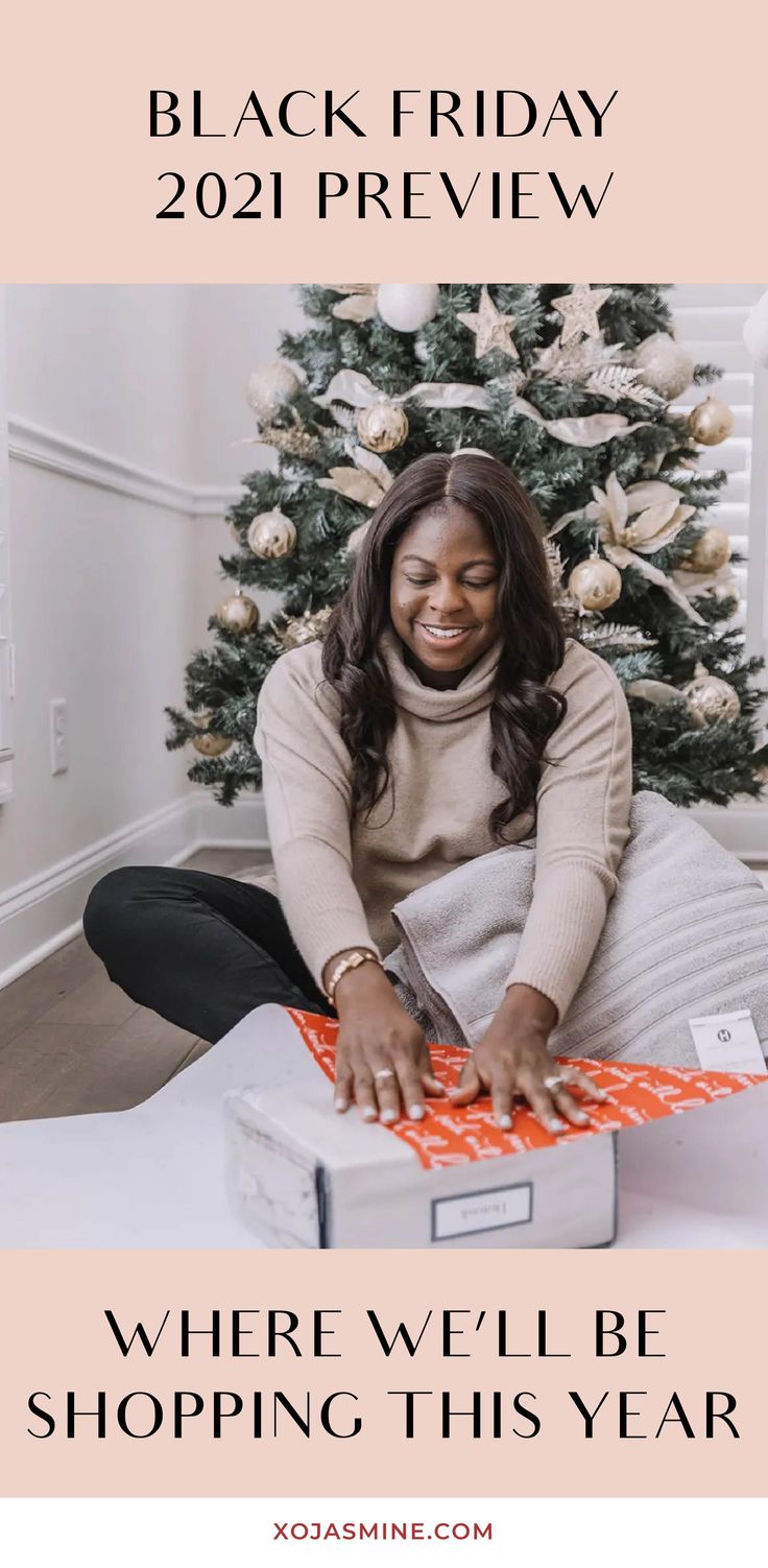 a woman sitting on top of a bed next to a christmas tree with the words, black friday 2021 preview where we'll be shopping this year