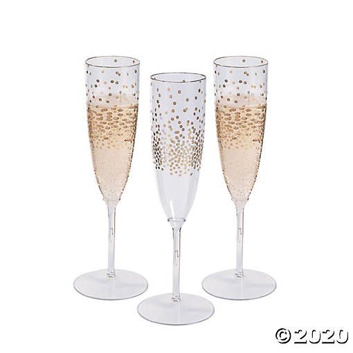 three champagne flutes sitting next to each other