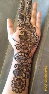 the hand is decorated with black henna