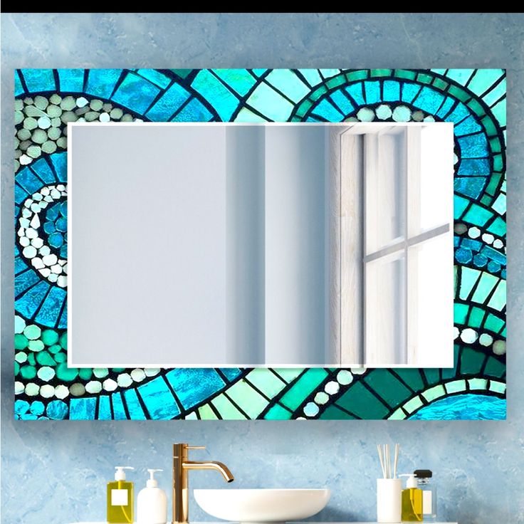 a bathroom vanity with a stained glass mirror above it