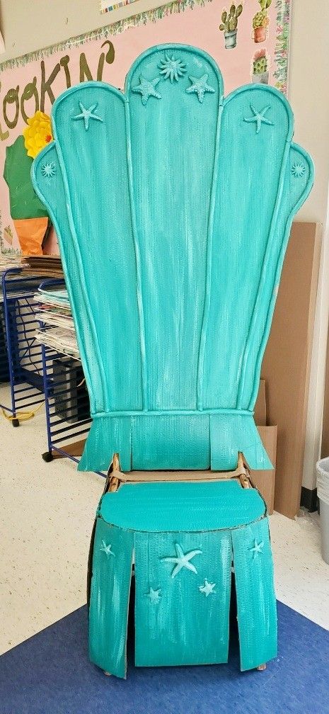 a blue chair sitting on top of a blue rug