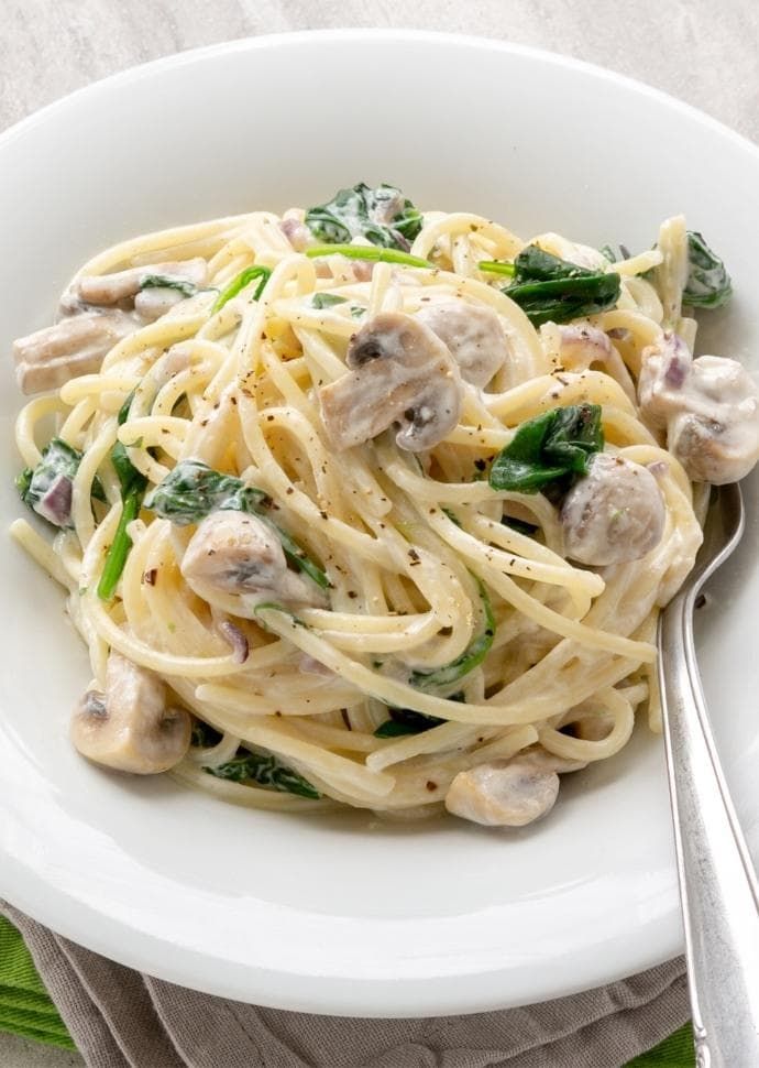 this creamy mushroom spinach pasta is so good it's ready to be eaten