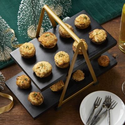 a table with plates and silverware on it, including muffins in the shape of a triangle