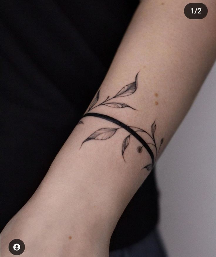 a woman's arm with a small tattoo on the left side of her wrist