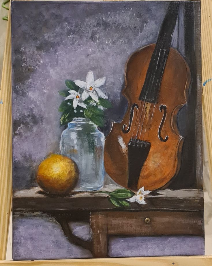 an oil painting of a violin, lemon and glass jar on a table with flowers