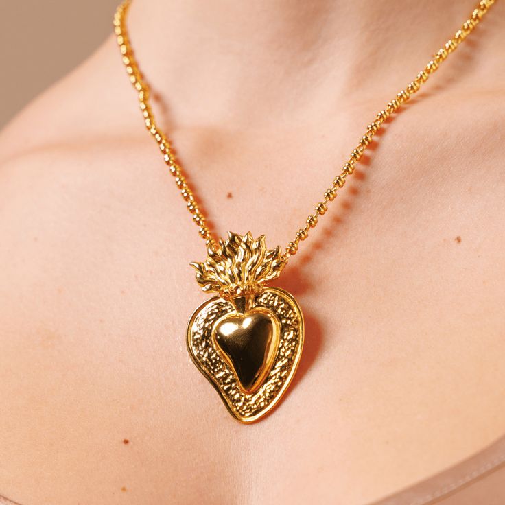 Based on a DelBrenna family design, our Flaming Heart pendant represents our passion for our craft. We love beauty, fashion, and sharing our creativity with you. This pendant calls you to open your heart and share your wonderful self with the world! Pendant in 925 silver with Yellow Gold Finish. It is 2 1/4” in height and 1 1/2” wide. Its bail slides onto all DelBrenna chains up to 5mm. Chain sold separately. Heart Beads Pendant Jewelry As Gift For Her, Sterling Silver Heart Pendant Jewelry With Heart Beads, Sterling Silver Heart Pendant With Heart Beads, Sterling Silver Heart Pendant Jewelry With Charms, Heart Bead Pendant Necklace As Gift For Her, Heart-shaped Symbolic Jewelry For Jewelry Making, Fine Jewelry With Heart Charm For Gift, Double Heart Sterling Silver Jewelry With Heart Detail, Sterling Silver Double Heart Jewelry With Heart Detail