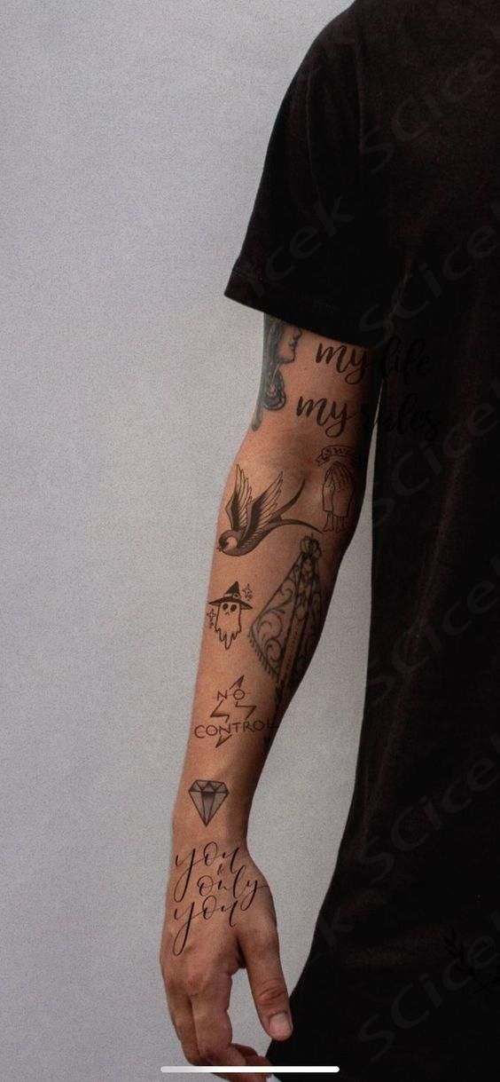 a man with many tattoos on his arm