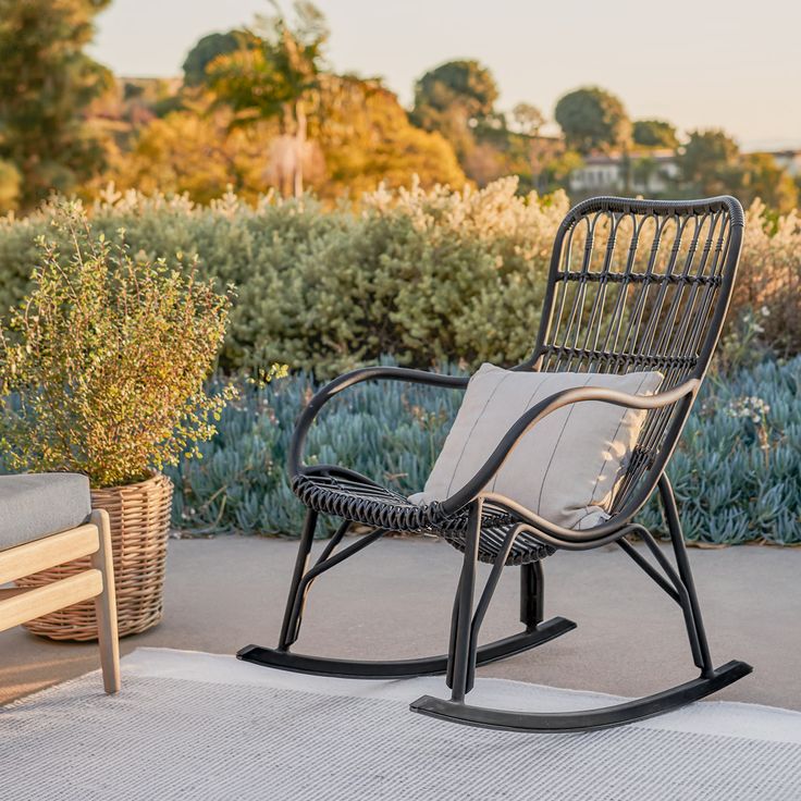 a rocking chair sitting on top of a patio