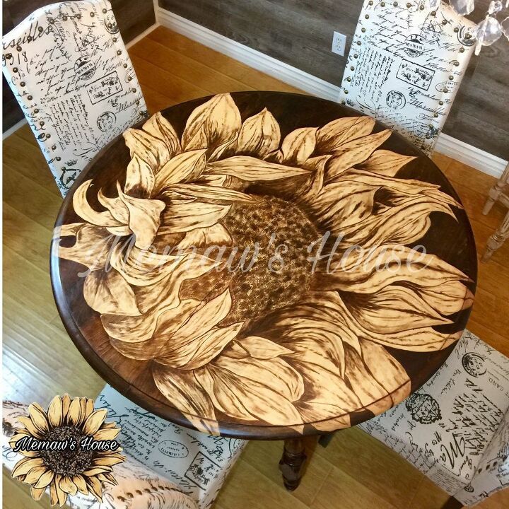 a wooden table with sunflowers painted on it