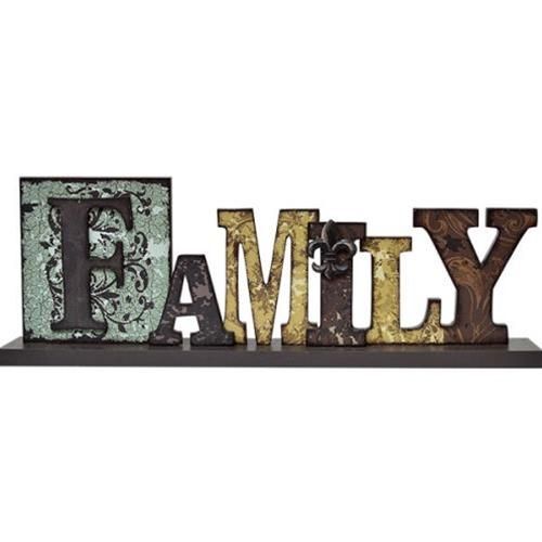 the word family written in rusty metal letters on a shelf with an old - fashioned photo frame