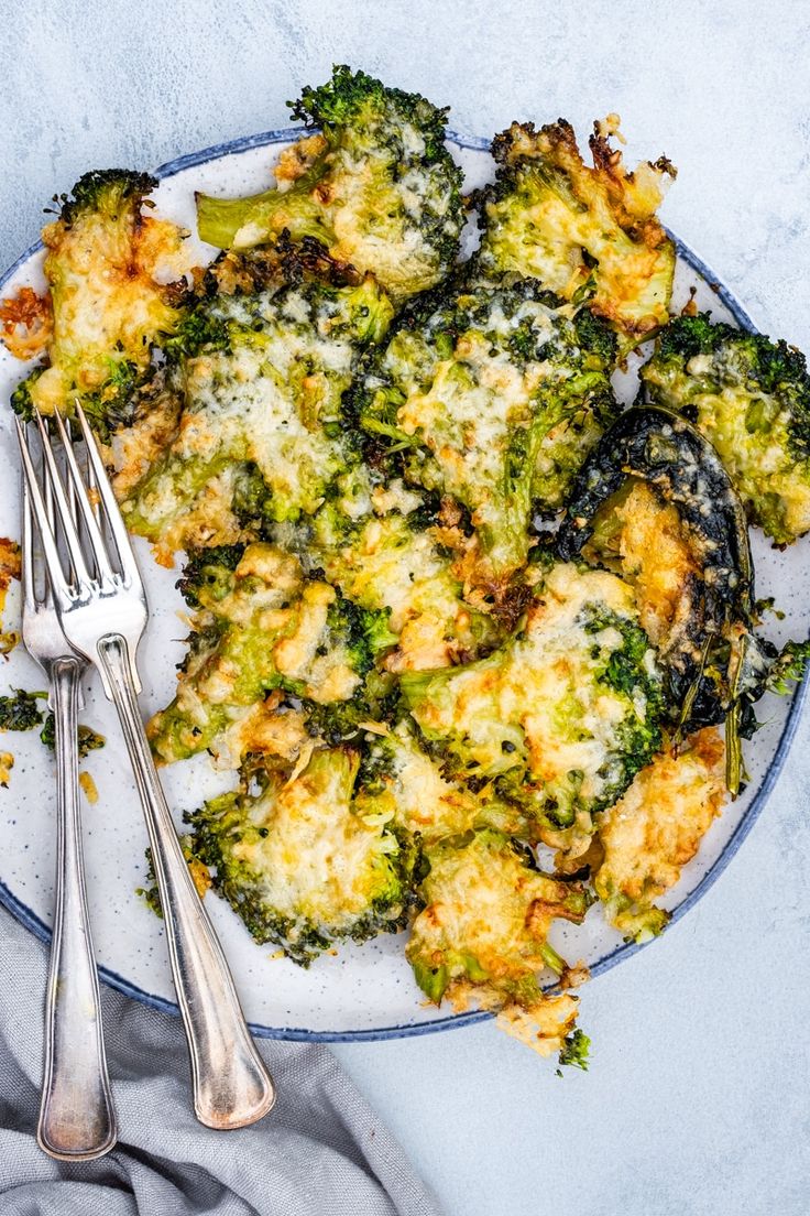 broccoli and cheese casserole on a plate with a fork next to it