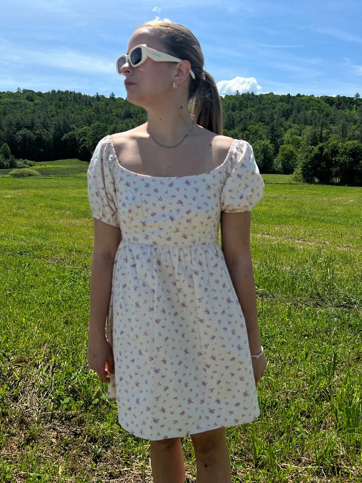 Introducing our Rosette Babydoll Dress, the perfect addition to your summer wardrobe. Made from 100% cotton, this floral mini dress exudes femininity and grace. The model is 5'3" and wearing a size small. Stay cool and stylish all summer long with this must-have dress that runs true to size. Size rec: S - 2-4 M - 4-6 L - 8-10 Short Dress White, Baby Doll Dress, Floral Mini Dress, Babydoll Dress, Stay Cool, Dress Romper, Baby Doll, Summer Wardrobe, Doll Dress