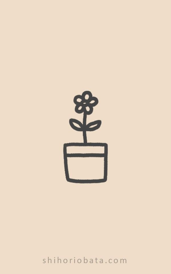 a small flower in a pot on a beige background