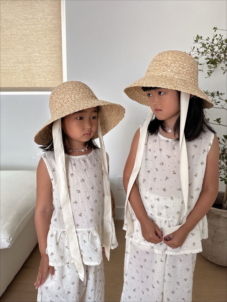 Get ready, the Ella Summer Girl Hat has arrived. Featuring with cotton neck tie and adjustable string inside the hat, this is the ultimate seaside accessory for your mini. Size: One Size 53cm Suitable for children aged 3+ years. Color: Off White Imported White Summer Sun Hat For Playtime, White Bucket Hat For Summer Playtime, Adjustable White Sun Hat For Playtime, Playful White Adjustable Sun Hat, Cute Cotton Sun Hat For Vacation, Casual Summer Sun Hat For Playtime, Summer Bucket Hat For Playtime, Summer Playtime Sun Hat With Curved Brim, Adjustable Summer Bucket Hat For Playtime