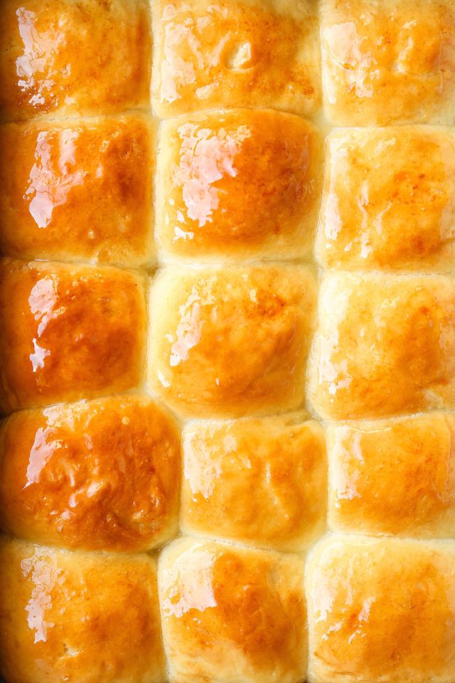 a close up view of some bread rolls with cheese on top and sauce in the middle