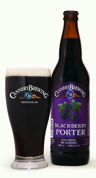 a bottle of black berry porter next to a glass full of beer on a white background