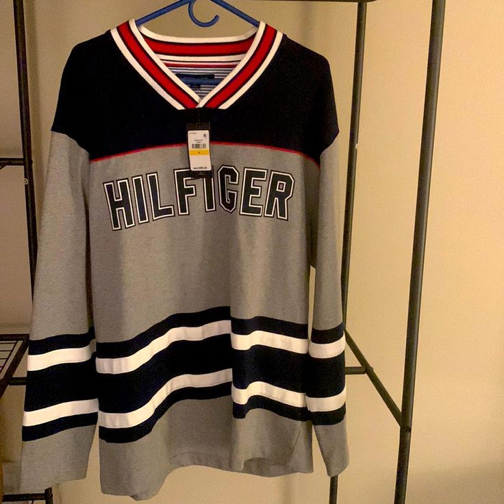 Tommy Hilfiger Sweatshirt. Navy Blue, Gray, White, And Red. Never Worn. Excellent Condition. Gray Long Sleeve College Sweater, Gray Long Sleeve Sweater For College, Casual Tommy Hilfiger Cotton Sweater, Tommy Hilfiger Casual Tops For College, Casual Tommy Hilfiger Tops For College, Tommy Hilfiger Sporty Top With Ribbed Cuffs, Tommy Hilfiger Cotton College Tops, Tommy Hilfiger Winter Streetwear Tops, Casual Blue Tommy Hilfiger Sweater