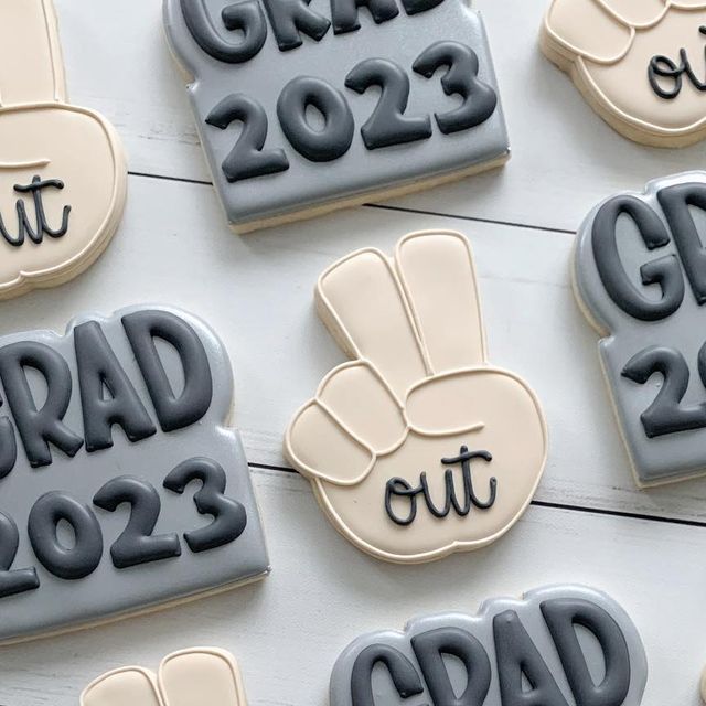 decorated cookies with the words grad out on them