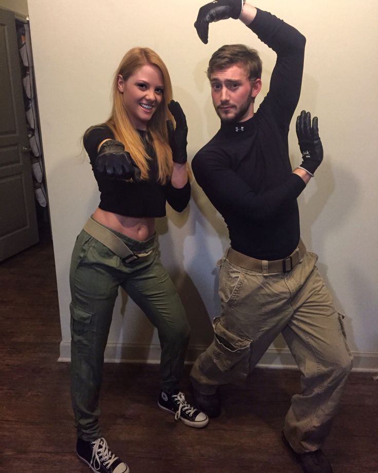 a man and woman dressed in costume posing for the camera with their hands on their hipss