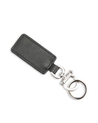 a black leather keychain with a metal ring