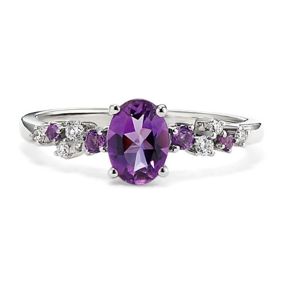 This sterling silver ring features a natural amethyst gemstone at its center for a pretty pop of color. Staggered natural amethyst and diamond accents create a floral look. Elegant Purple Birthstone Ring With Gemstone Accents, Elegant Purple Birthstone Ring With Center Stone, Elegant Purple Gemstone Birthstone Ring, Elegant Purple Diamond Ring With Gemstone Accents, Elegant Purple Birthstone Ring With Accent Stones, Amethyst Diamond Ring With Gemstone Accents For Promise, Elegant Purple Diamond Birthstone Ring, Purple Multi-stone Amethyst Ring Fine Jewelry, Fine Jewelry Purple Amethyst Multi-stone Ring