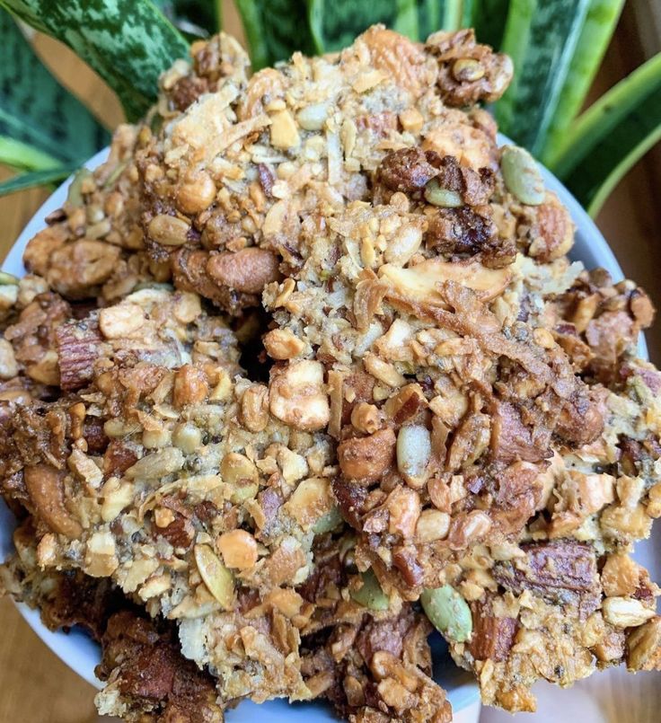 a plate filled with granola and nuts