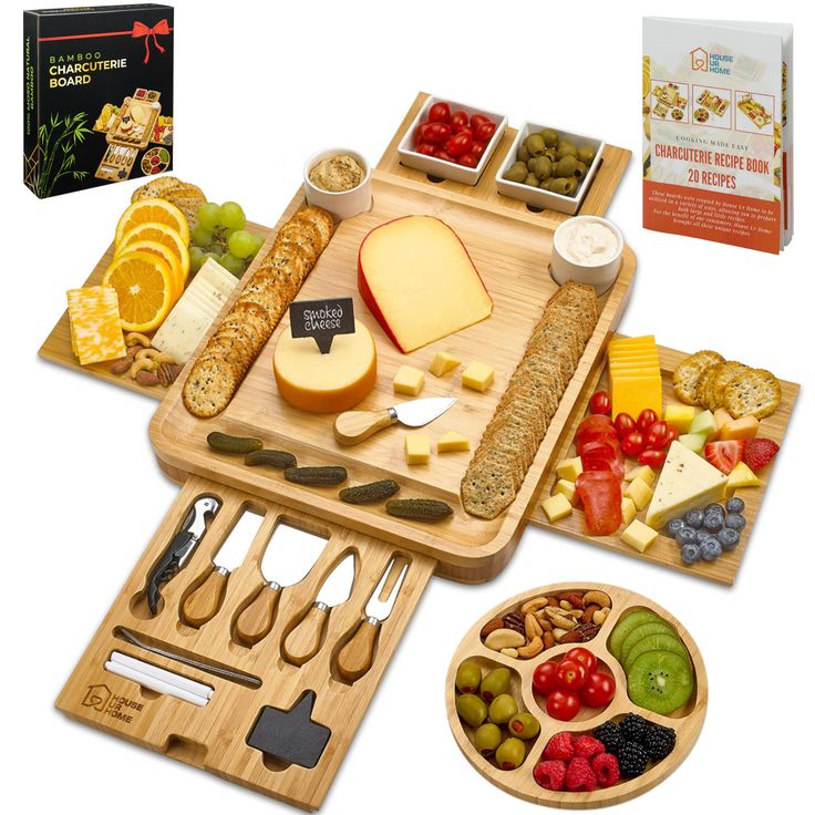 an assortment of cheeses, fruits and crackers on a wooden cutting board with matching utensils