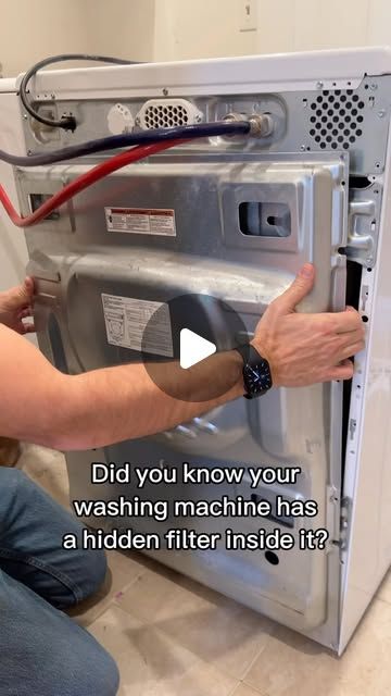 a man is fixing an old microwave