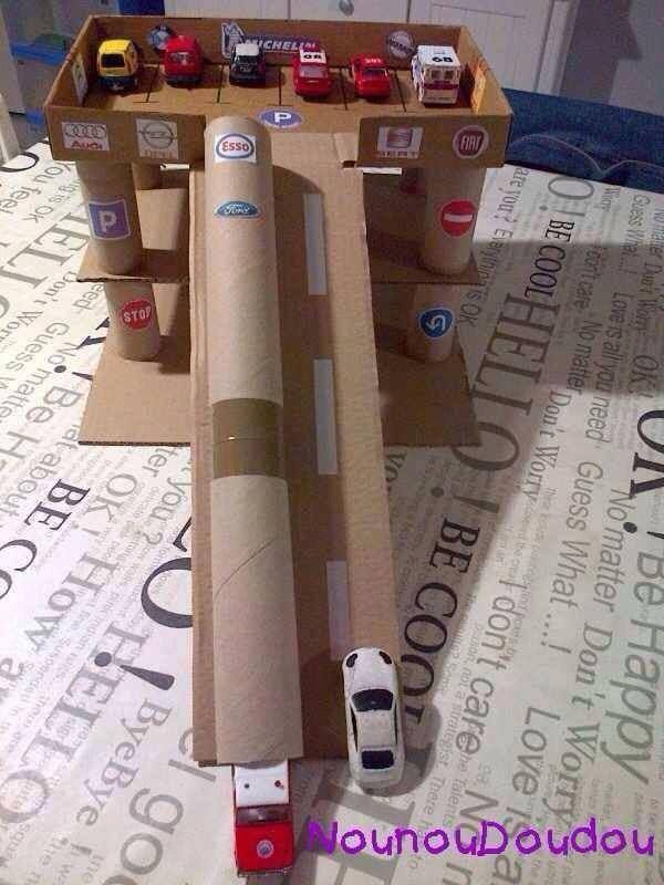 there is a cardboard table with cars on it