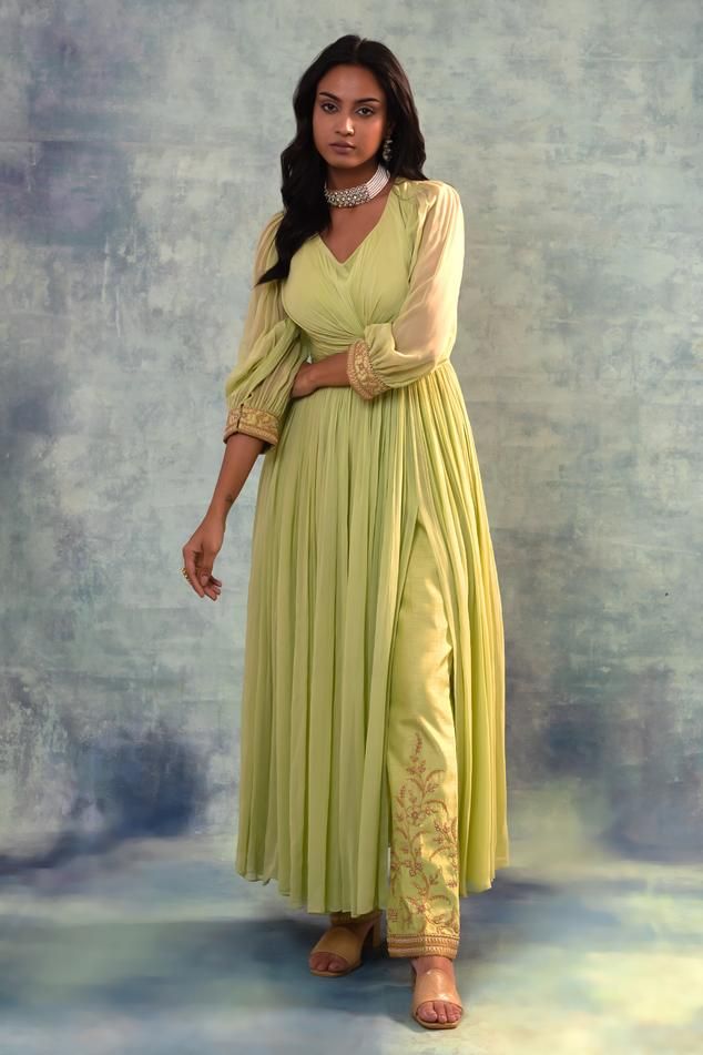 Green kurta with floral hand embroidery on sleeves and all over gathers. Paired with pant.
Components: 2
Pattern: Embroidered
Type Of Work: Floral
Neckline: V neck
Sleeve Type: Puff
Fabric: Kurta - Georgette, Pants - Silk
Color: Green
Other Details: 
Gathers
Length:
Kurta: 55 inches
Pant: 38 inches
Occasion: Puja - Aza Fashions Floral Hand Embroidery, Pant Set, Set For Women, Aza Fashion, Fashion Set, Sleeve Type, Hand Embroidery, Pants Set, Types Of Sleeves