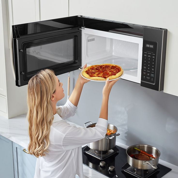 Our sleek and versatile Over-the-Range Microwave is perfectly designed for your modern kitchen. With a 1.7 cu. ft. Capacity, this microwave makes it easy to heat large plates and platters. Its Sensor Cooking Technology detects your food’s moisture levels and automatically adjusts the cooking time to prevent cold spots. You can also connect your microwave to the SmartHome app to utilize voice commands, adjust settings, and monitor cooking progress from your phone. All these great features and mor Smarthome App, Over The Range Microwave, Black Microwave, College Essentials, Range Microwave, Cold Prevention, Soften Cream Cheese, Food Covers, Microwave Recipes