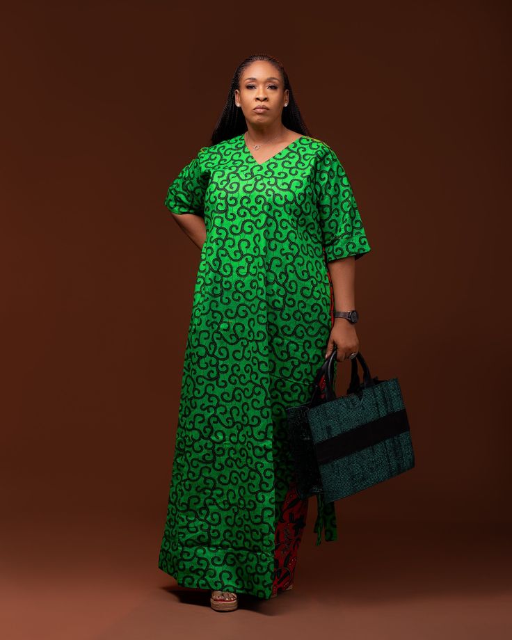 Double print Ankara Kafthan with fringes at the back Ps. Bag is sold separately Mothers Ankara Style, Flowered Chiffon Gown Styles, Ankara Gowns Long, Long Ankara Gowns, Grand Dakar, Ankara Long Gown, Nigerian Lace Styles Dress, Long African Dresses, Ankara Gowns