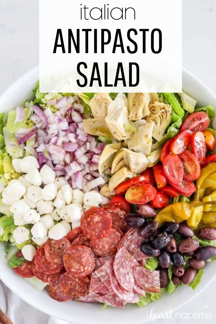 a white bowl filled with different types of food and the words italian antipasto salad above it