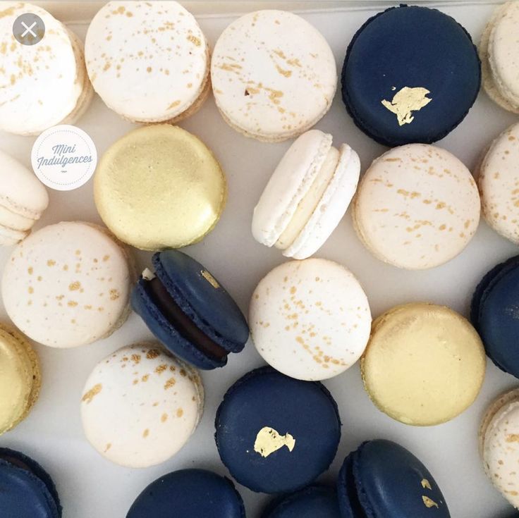 a box filled with different types of macaroons