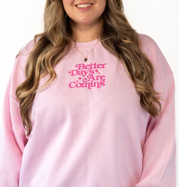 Whatever you're going through, just know there are better days ahead. This sweater is a great reminder of that. Featuring a retro embroidered font with the saying "Better Days Ahead" in hot pink across the center chest. This crewneck sweater has a slightly lighter exterior and runs a tad bit boxier and wider with stretch. For a fully loose oversized look, size up. This item is made to order in our shop so please allow up to one week processing time (we usually take less than that though). Detail Pink Cotton Sweater With Text Print, Pink Cotton Sweater With Slogan, Pink Text Print Sweater For Winter, Pink Winter Sweater With Text Print, Pink Text Print Winter Sweater, Pink Slogan Sweatshirt For Spring, Pink Slogan Crew Neck Sweater, Pink Slogan Sweater Crew Neck, Pink Crew Neck Sweater With Text Print