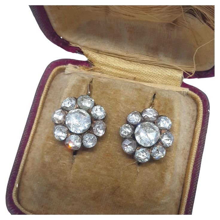 Antique rose cut diamond earrings in floral design with large rose cut diamonds with a total estimate diamond weight of 11 carats center stone diameter 7.30mm/ smaller stone diameter 5.30mm and earing head diameter 15.70 mm back foiled old technique 10k gold setting excellent diamond spark with earrings head diameter of 1.5 cm and earrings length of 2.5 cm dates back to 1850.c victorian era Diamond Gold Earrings, Daisy Earrings, Antique Roses, Victorian Jewelry, Diamond Gold, Gold Set, Rose Cut Diamond, Precious Gemstones, Design Floral