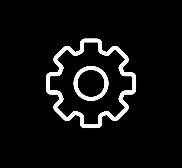 a black and white image of a cogwheel on a dark background, with the letter o in the center