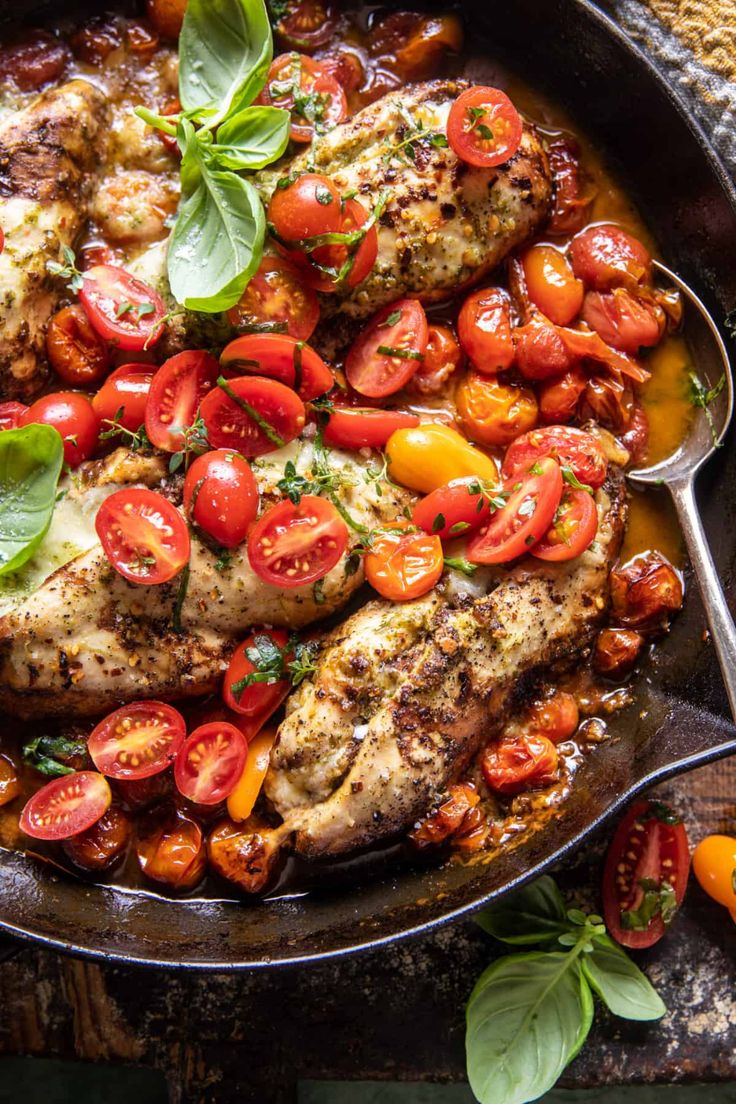 chicken with tomatoes and basil in a skillet