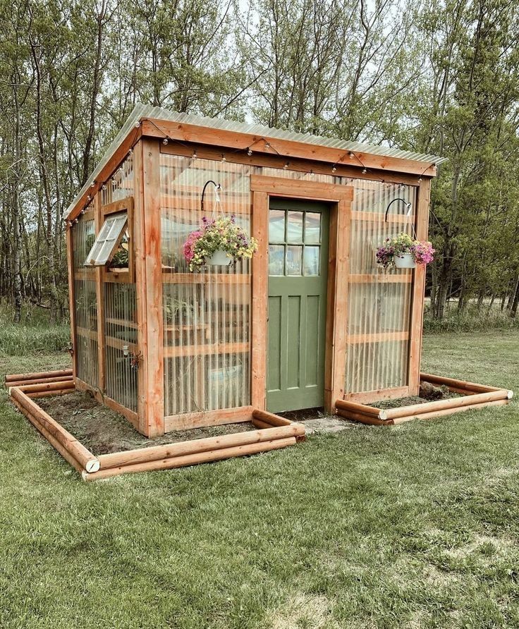 a small wooden shed with plants growing out of the doors and windows on it's sides