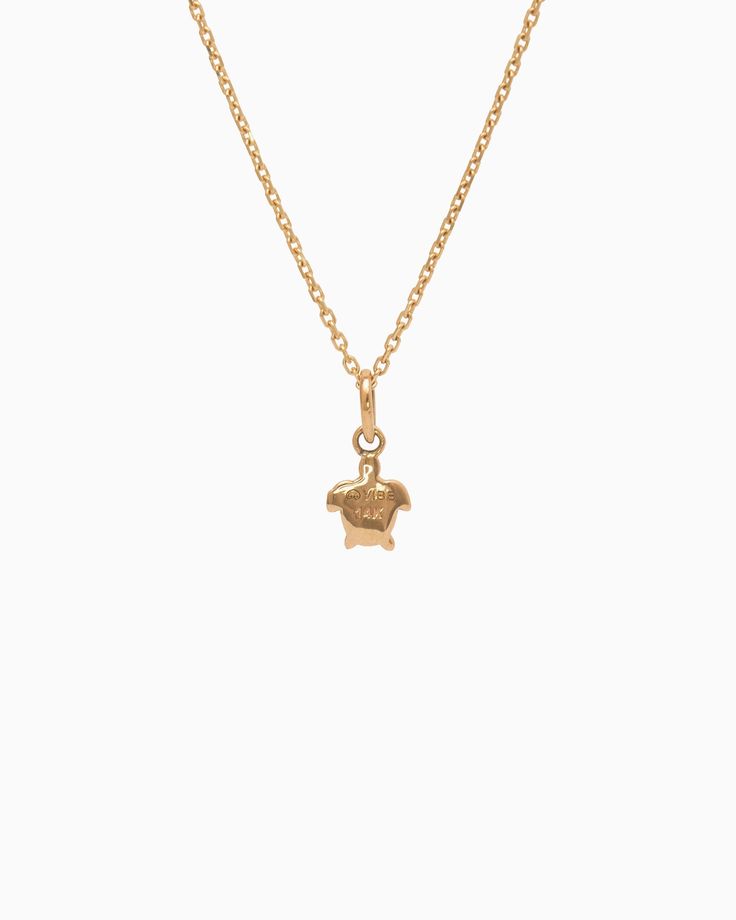 The Turtle Charm is handcrafted in 14K solid gold and features a detailed design inspired by sea turtles, celebrated as iconic symbols of the Caribbean. Playful yet sophisticated, this charm complements any look. Pair with your favorite hook bracelet or dainty chain, sold separately. Metal: 14K solid gold Dimensions: 9.5mm x 6mm x 2mm Style #: GC203S Elegant Gold Plated Jewelry With Logo Charm, Classic Gold Plated Jewelry With Logo Charm, Classic Gold-plated Jewelry With Logo Charm, Elegant Yellow Gold Jewelry With Logo Charm, Elegant Pendant Charms With Logo, Elegant Gold Charms With Logo, Elegant Yellow Gold Charm Necklace With Logo, Elegant Gold Charm With Logo, Elegant Pendant Logo Charm