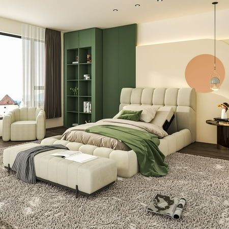 a large bed sitting in the middle of a living room next to a book shelf