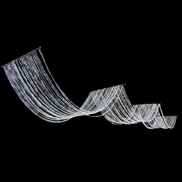 an artistic string art piece is shown in the dark, with white lights on it