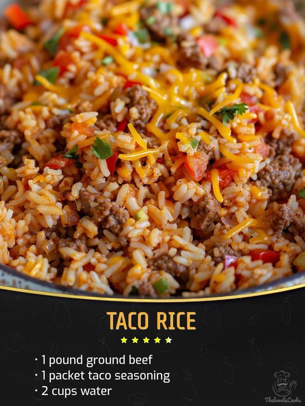 taco rice with ground beef, tomatoes and cheese in a bowl on a table